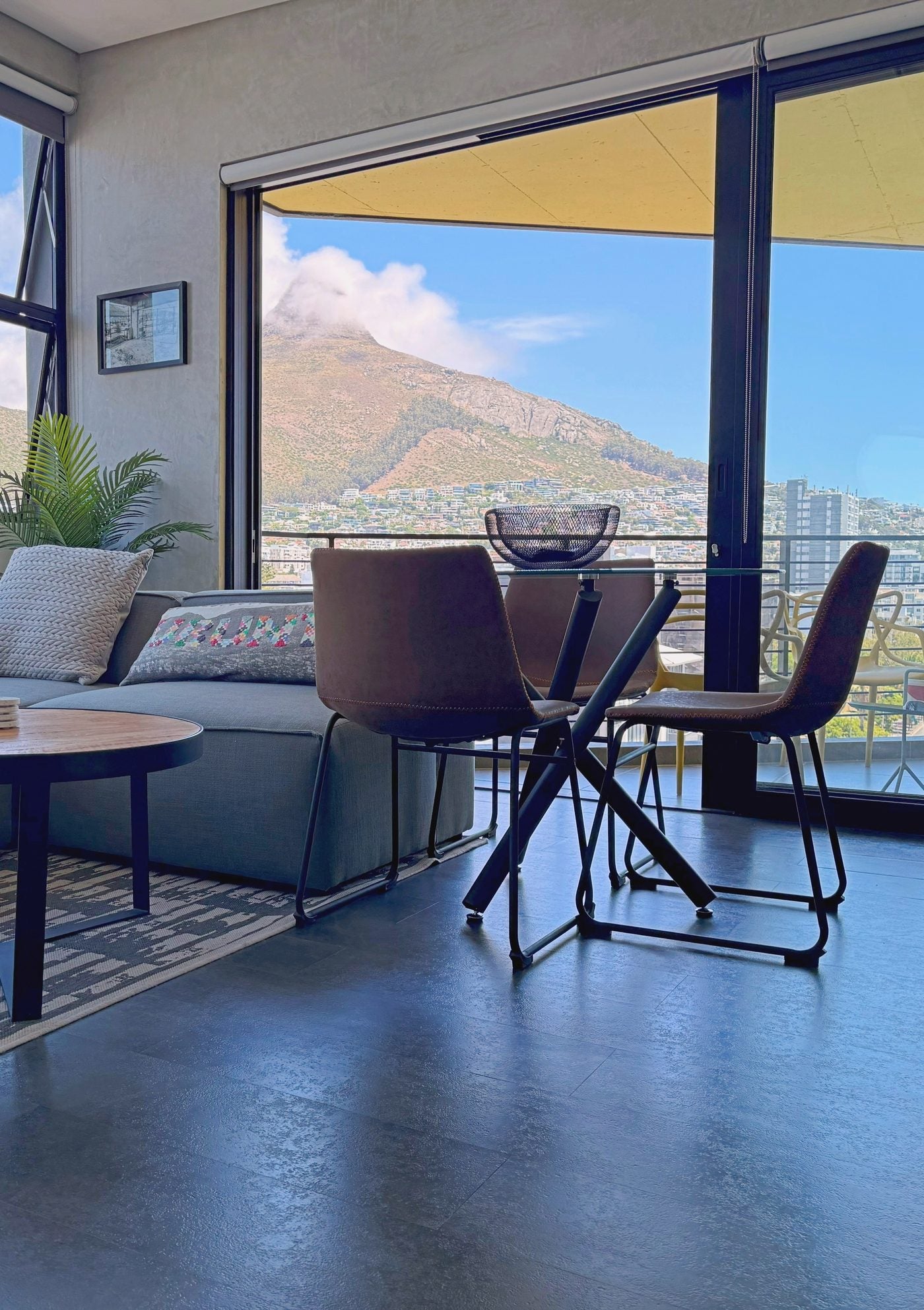 The lounge at One26 on M, Sea Point, with Lion's Head through the window